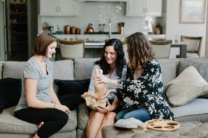 Kansas City Newborn Care specialists demonstrating newborn care techniques during an in-home consultation