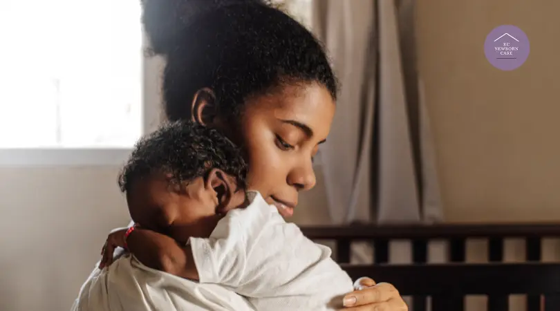 Parent gently holding a newborn against their shoulder to offer comfort and bonding time